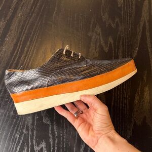 COCLICO Black Snake-Embossed Leather Platform Sneaker with Orange Stripe